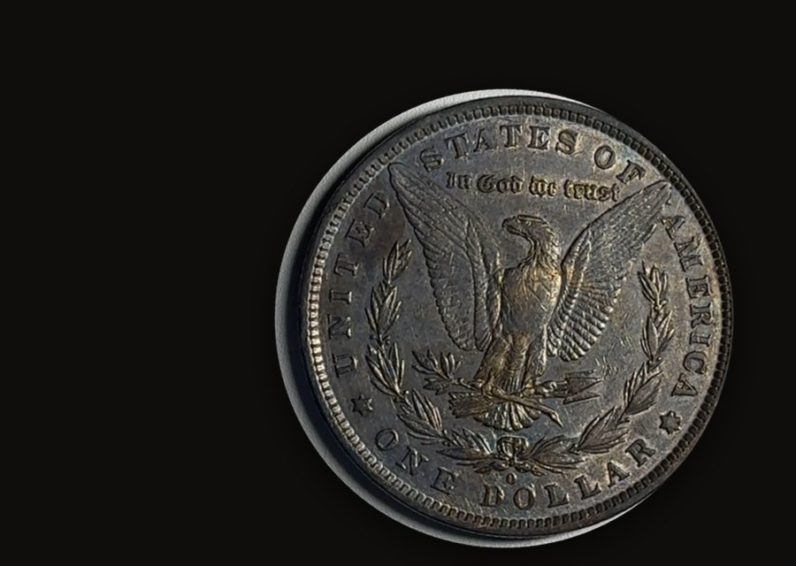 Reverse of an 1882-O Morgan dollar with dark original toning